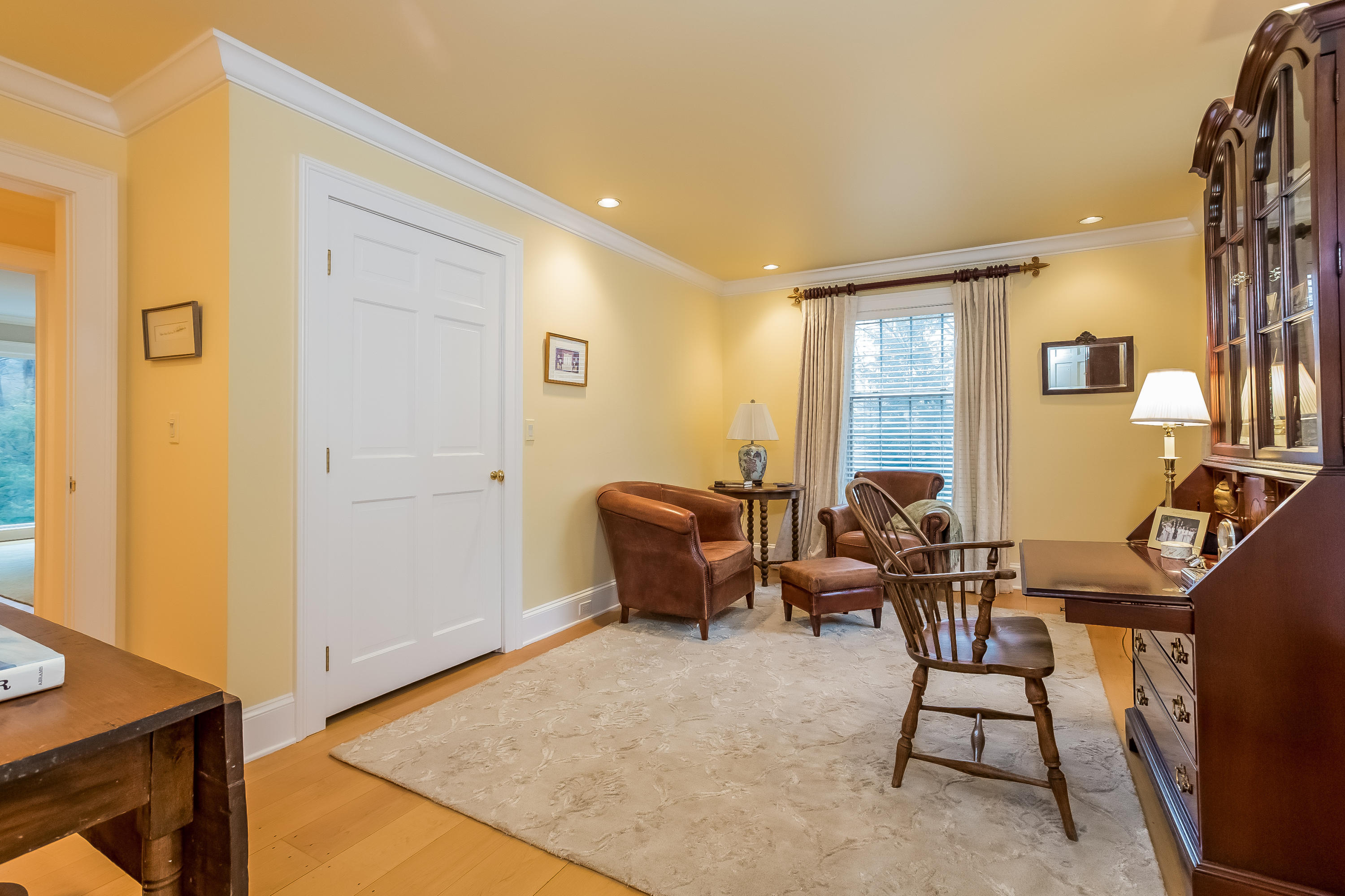 269 Valley Road New Canaan, CT 06840 - Photo 19 of 21 a living room with furniture a lamp and a window