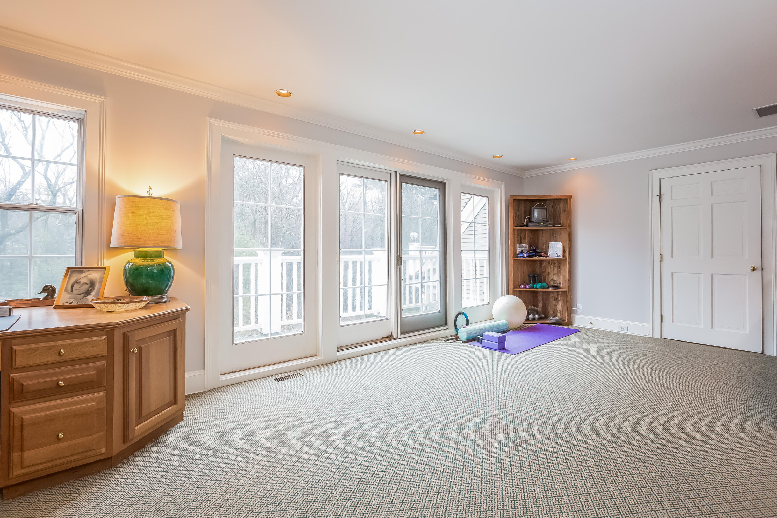 269 Valley Road New Canaan, CT 06840 - Photo 20 of 21 a bedroom with furniture and large windows