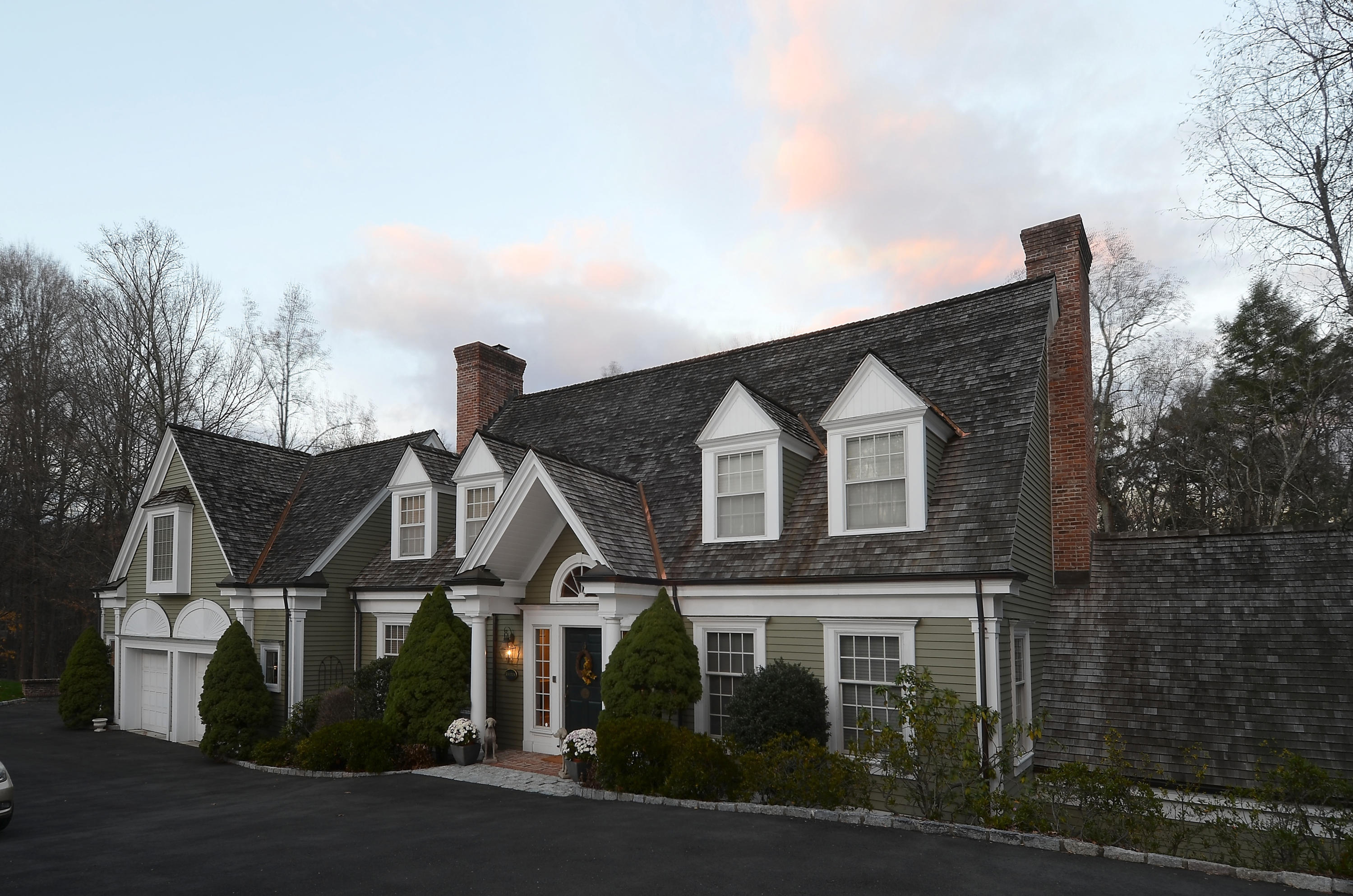 269 Valley Road New Canaan, CT 06840 - Photo 3 of 21 a view of a big house with a street