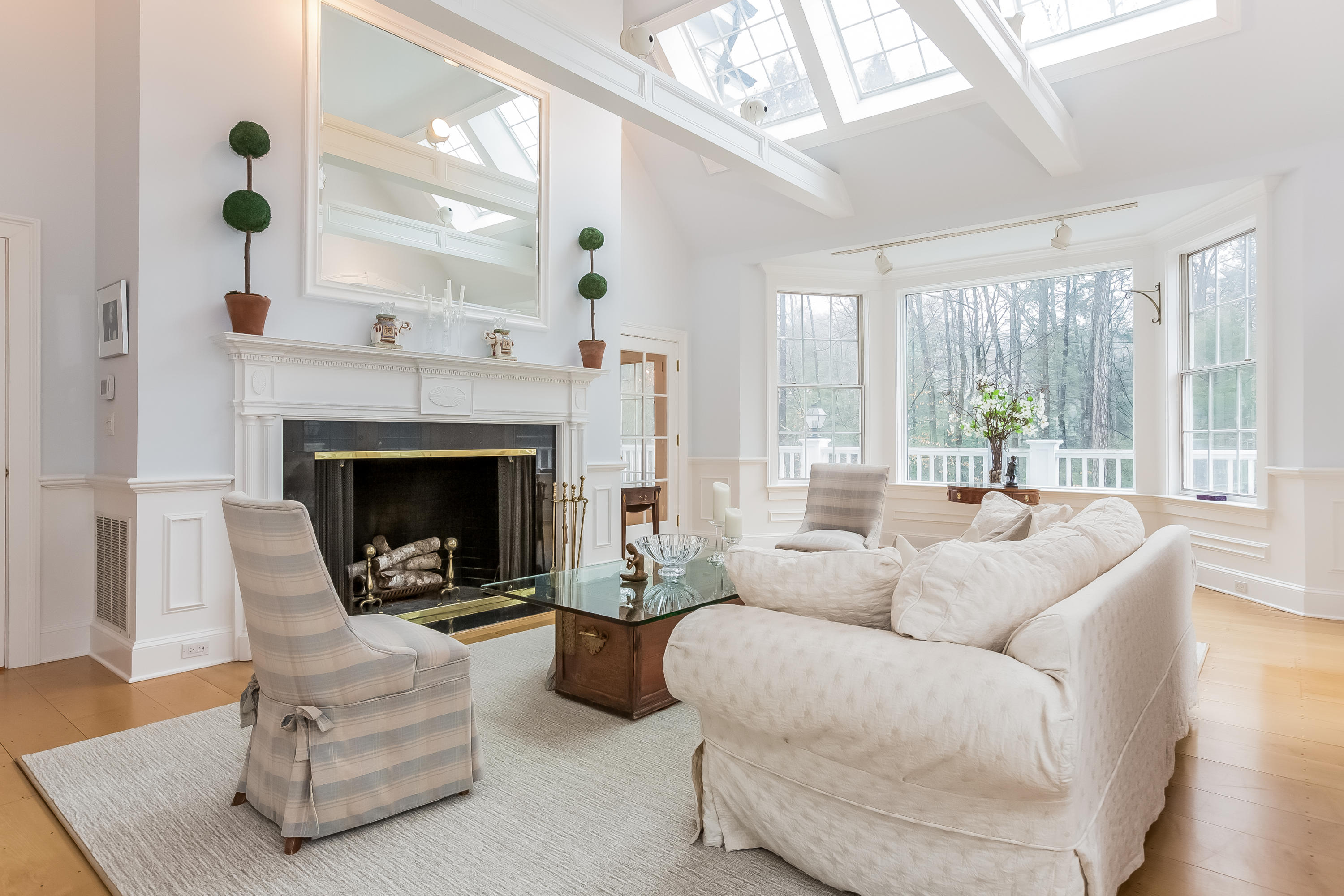 269 Valley Road New Canaan, CT 06840 - Photo 6 of 21 a living room with furniture and a fireplace