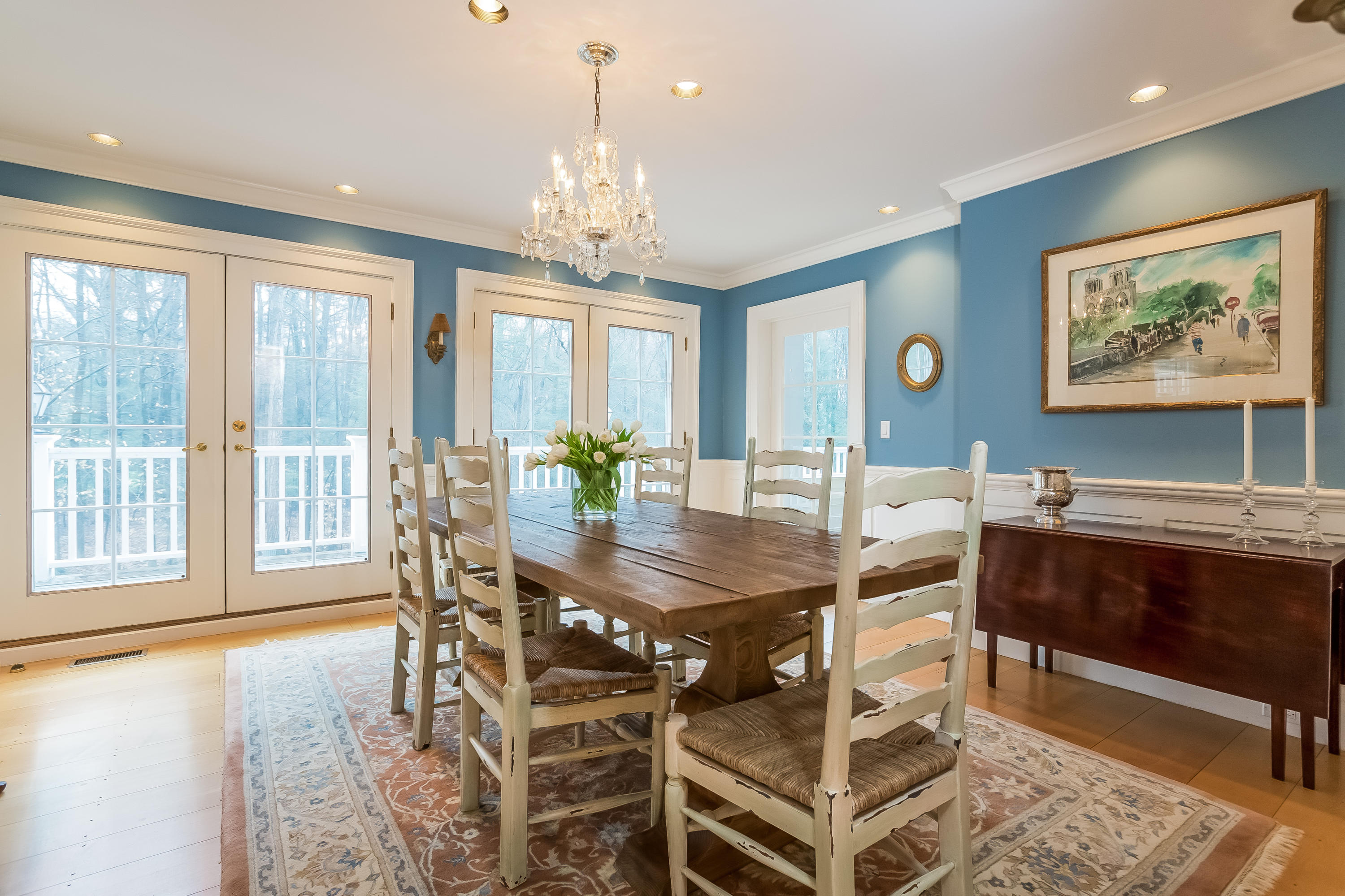 269 Valley Road New Canaan, CT 06840 - Photo 7 of 21 a view of a dining room with furniture a chandelier and wooden floor