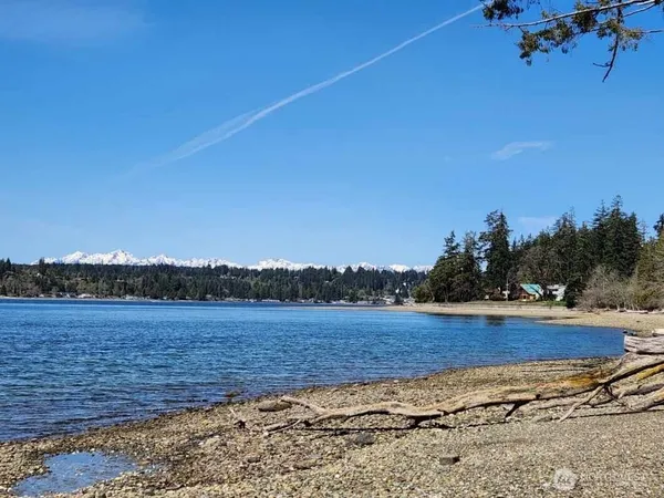 a view of a lake and mountains in the background