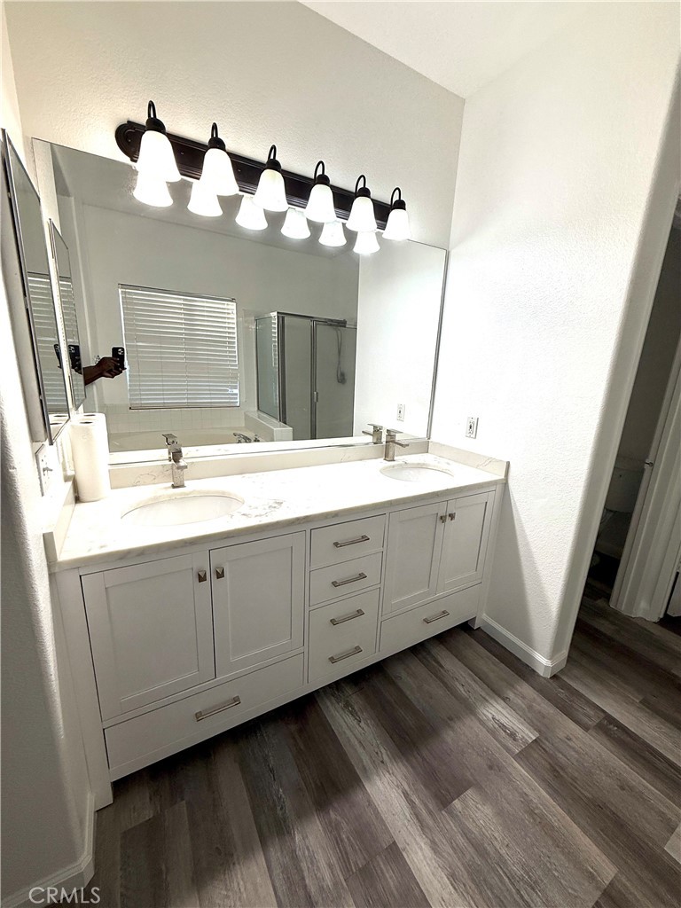 1335 Torrey Pines Court Atwater, CA 95301 - Photo 12 of 28 a bathroom with a double vanity sink and mirror