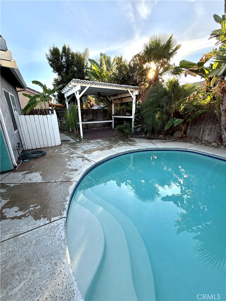 1335 Torrey Pines Court Atwater, CA 95301 - Photo 23 of 28 a view of a swimming pool with a patio and a yard