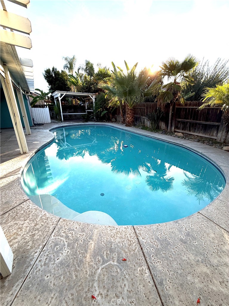 1335 Torrey Pines Court Atwater, CA 95301 - Photo 25 of 28 a view of a swimming pool with a yard