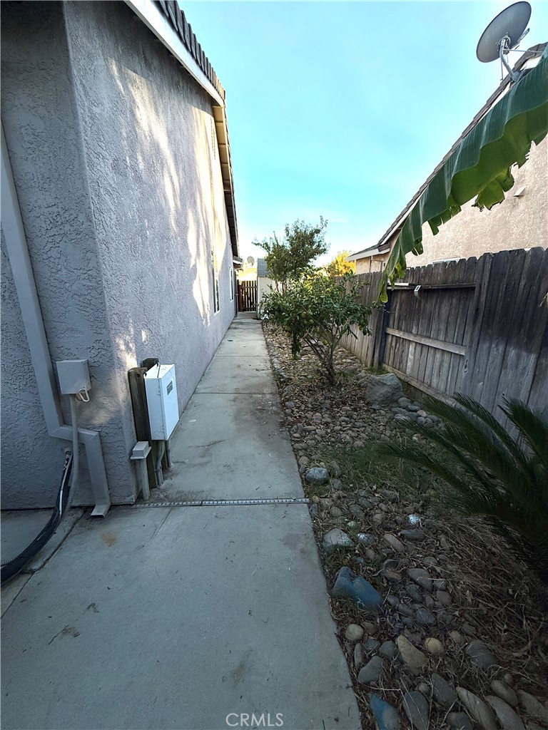 1335 Torrey Pines Court Atwater, CA 95301 - Photo 27 of 28 a view of stairs and yard with wooden fence