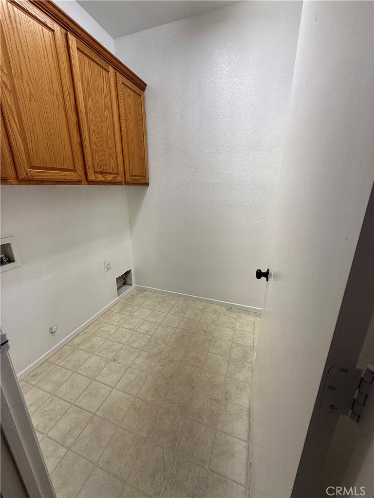 1335 Torrey Pines Court Atwater, CA 95301 - Photo 9 of 28 a bathroom with a sink and cabinets