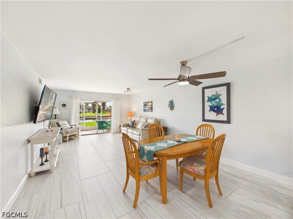 300 Valley Stream Drive, Unit 3D Naples, FL 34113 - Photo 7 of 21 a dining room with furniture and window
