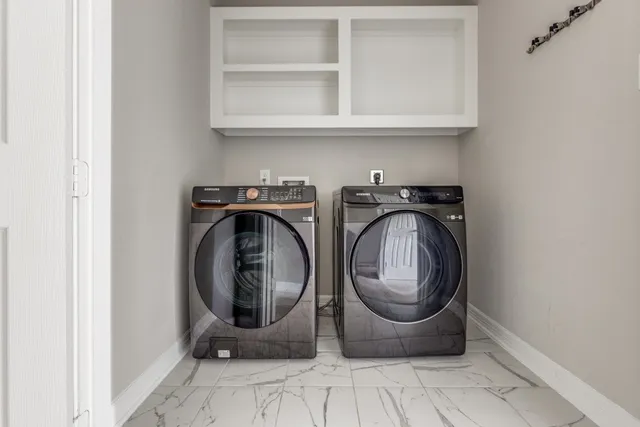 a view of washer and dryer in a utility room
