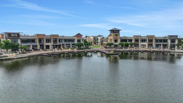 a view of a lake with building in front of it