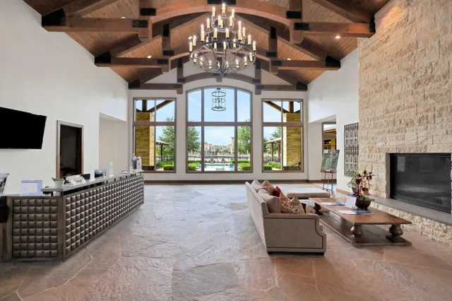 a living room with furniture fireplace and flat screen tv