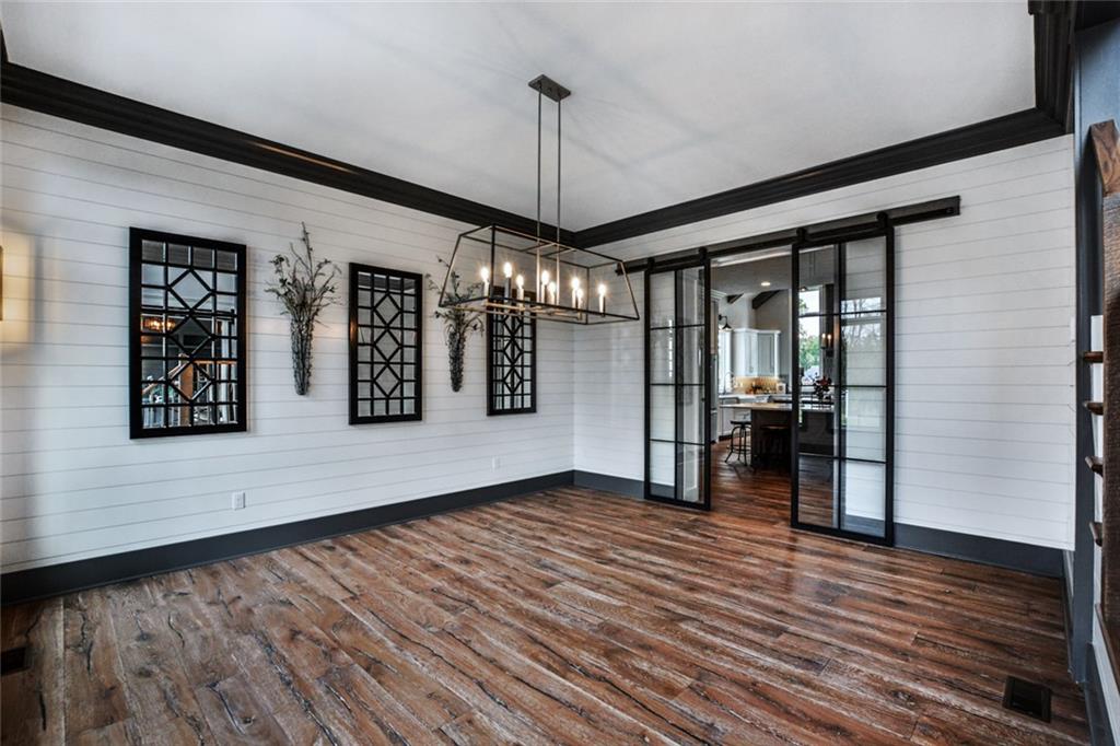 502 Ridge Court Wexford, PA 15090 - Photo 8 of 25 SPACIOUS DINING ROOM WITH SHIPLAP ACCENTS AND IRON AND GLASS BARN DOORS LEADING TO KITCHEN!