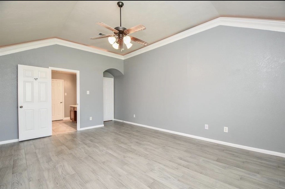 8515 Split Branch Lane Houston, TX 77095 - Photo 11 of 31 wooden floor in an empty room