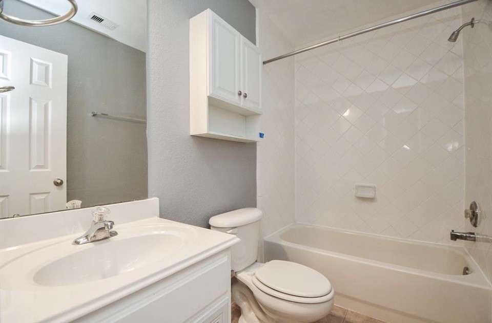 8515 Split Branch Lane Houston, TX 77095 - Photo 25 of 31 a bathroom with a sink toilet and shower