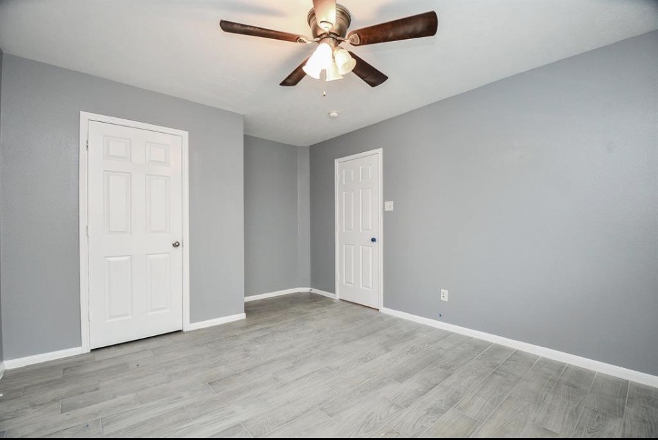 8515 Split Branch Lane Houston, TX 77095 - Photo 28 of 31 wooden floor in an empty room