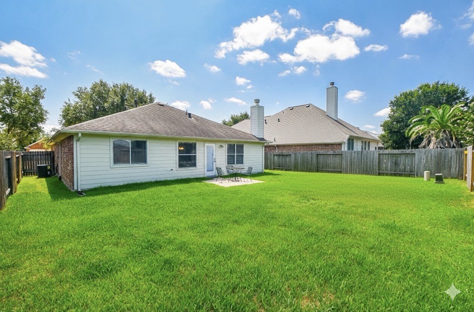 8515 Split Branch Lane Houston, TX 77095 - Photo 29 of 31 a front view of a house with garden