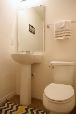 a bathroom with a toilet and a sink