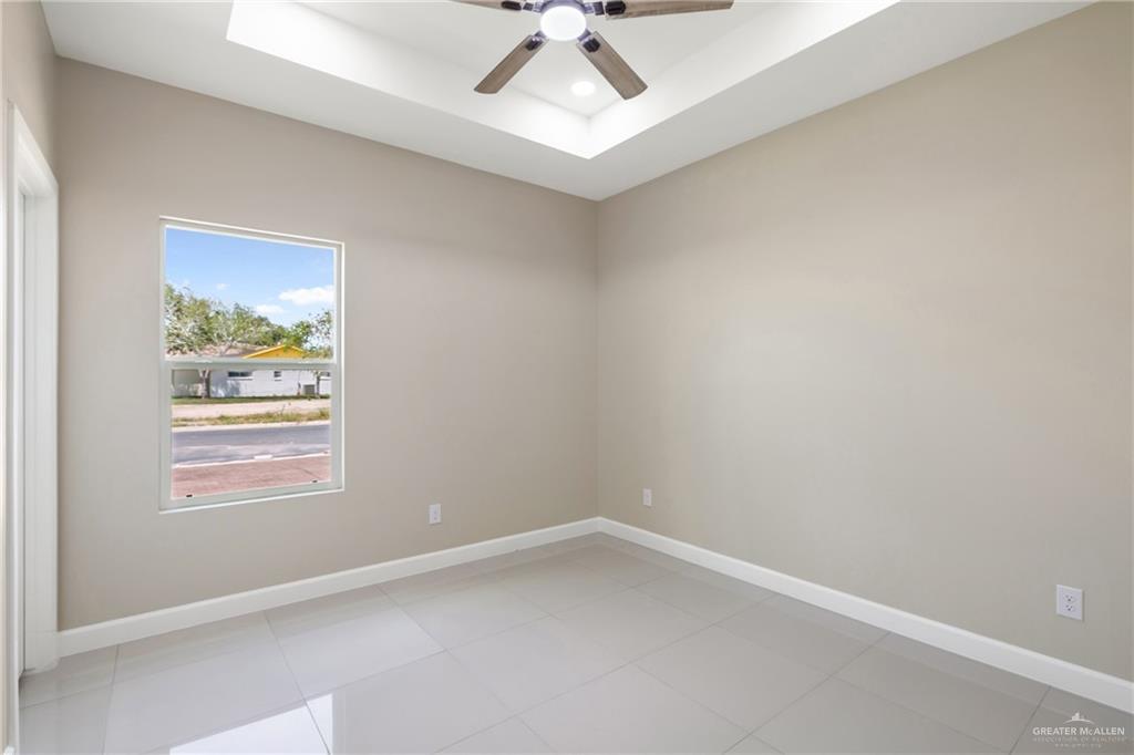 105 Lenon Street Edcouch, TX 78538 - Photo 13 of 19 an empty room with a window and a fan