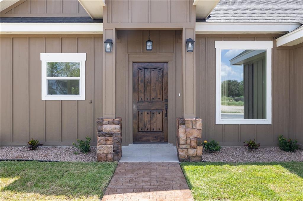 105 Lenon Street Edcouch, TX 78538 - Photo 2 of 19 a front view of a house with a yard