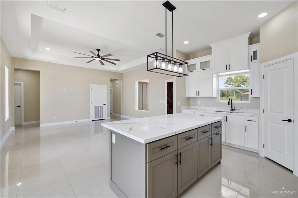 105 Lenon Street Edcouch, TX 78538 - Photo 4 of 19 a view of a kitchen center island and stainless steel appliances