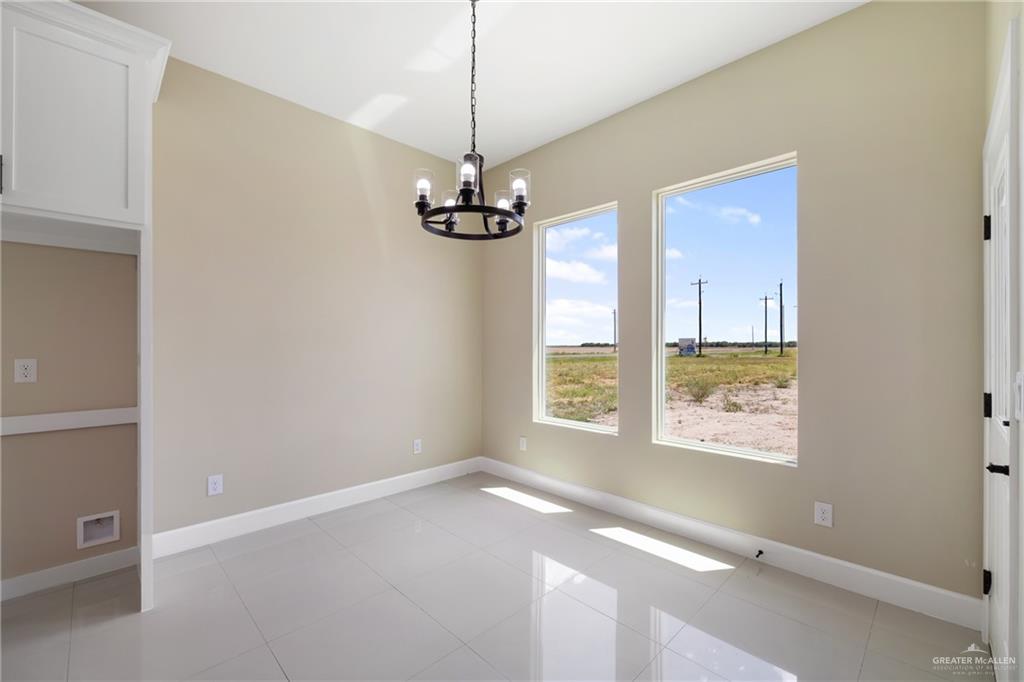 105 Lenon Street Edcouch, TX 78538 - Photo 9 of 19 a view of a livingroom with a ceiling fan and window
