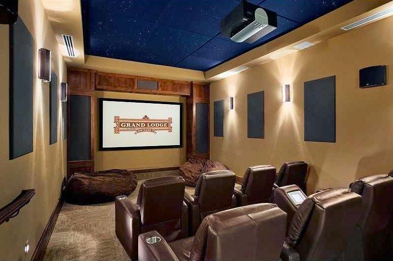 1979 Ski Hill Road, Unit 1314AB Breckenridge, CO 80424 - Photo 13 of 14 a projector room with furniture and a projector screen