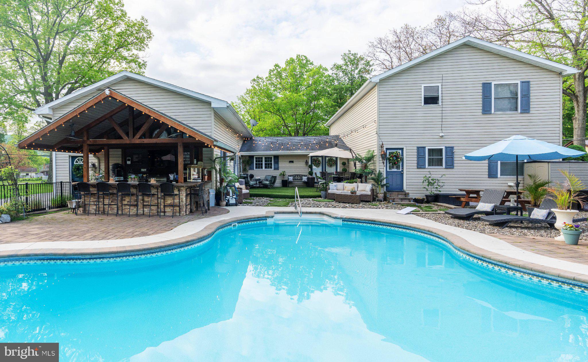 1002 Maple Lane Tyrone, PA 16686 - Photo 15 of 71 Serene backyard oasis with poolside charm.