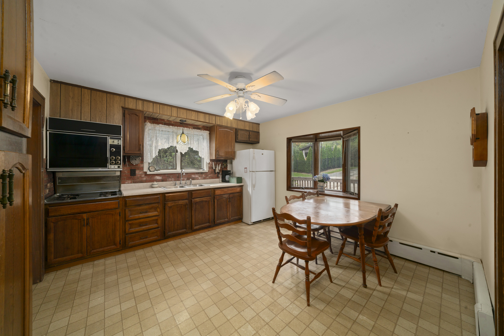 2110-a-b State Route 31 Oswego, IL 60543 - Photo 11 of 55 a kitchen with a table and chairs in it