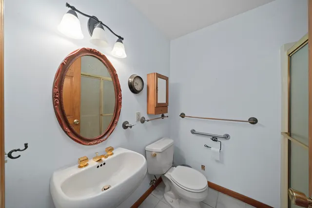 an empty room with a window and a ceiling fan