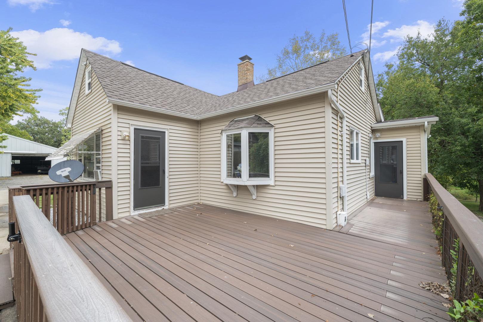 2110-a-b State Route 31 Oswego, IL 60543 - Photo 2 of 55 a view of a house with wooden deck