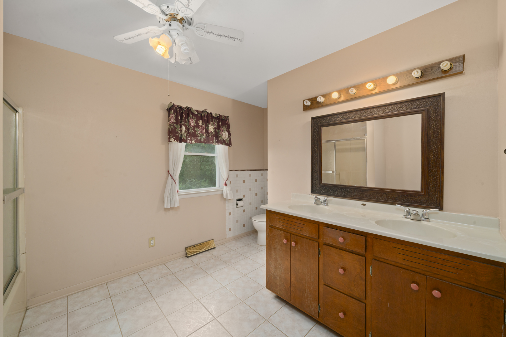 2110-a-b State Route 31 Oswego, IL 60543 - Photo 23 of 55 a bathroom with a toilet sink and mirror