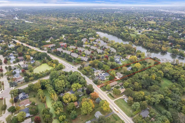 aerial view of a house with a yard and garage