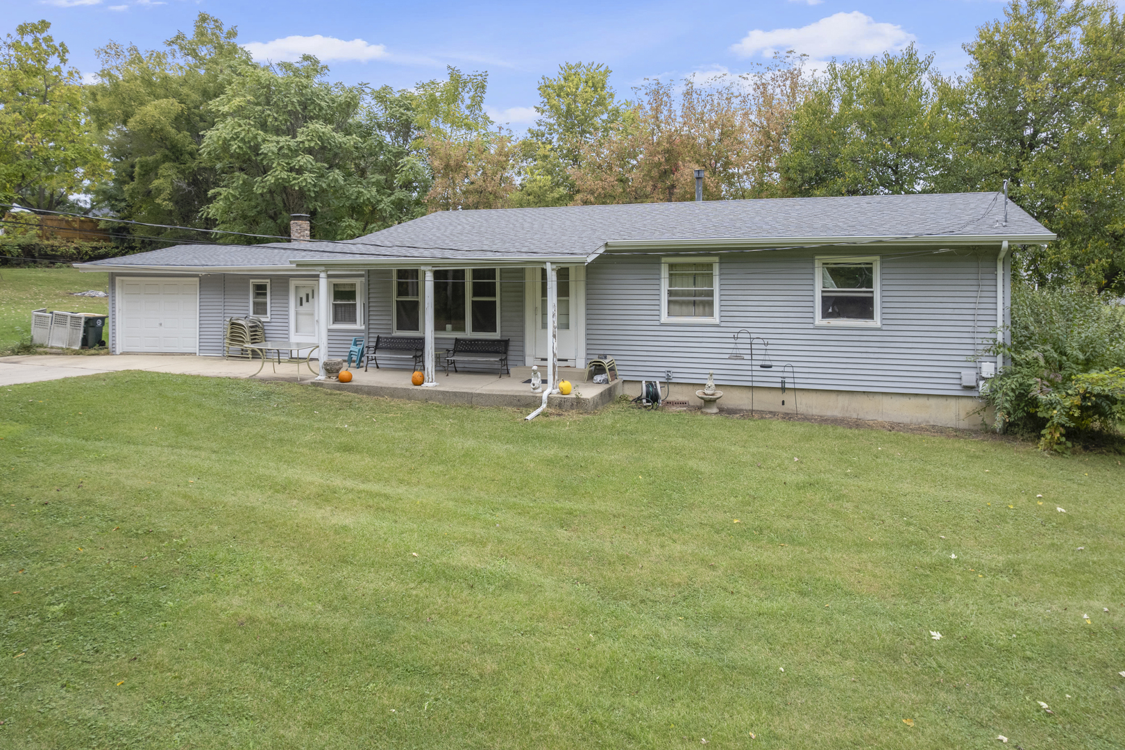 2110-a-b State Route 31 Oswego, IL 60543 - Photo 42 of 55 a front view of a house with a garden and trees
