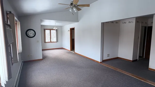 a view of a kitchen with a sink and cabinets