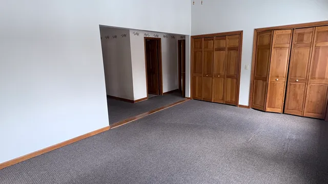 a kitchen with a sink refrigerator and window