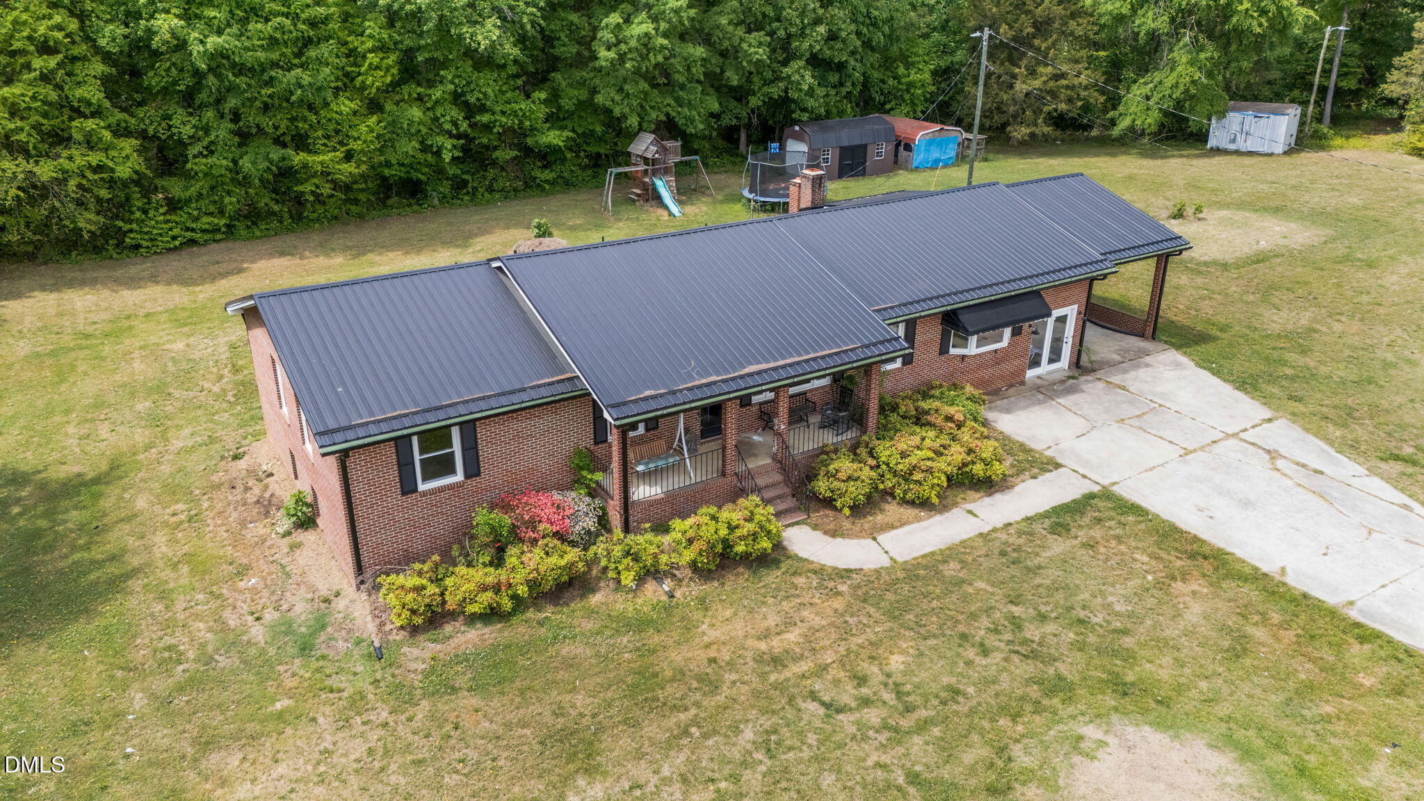 786 Dick Holeman Road Timberlake, NC 27583 - Photo 14 of 44 an aerial view of a house with yard and lake view