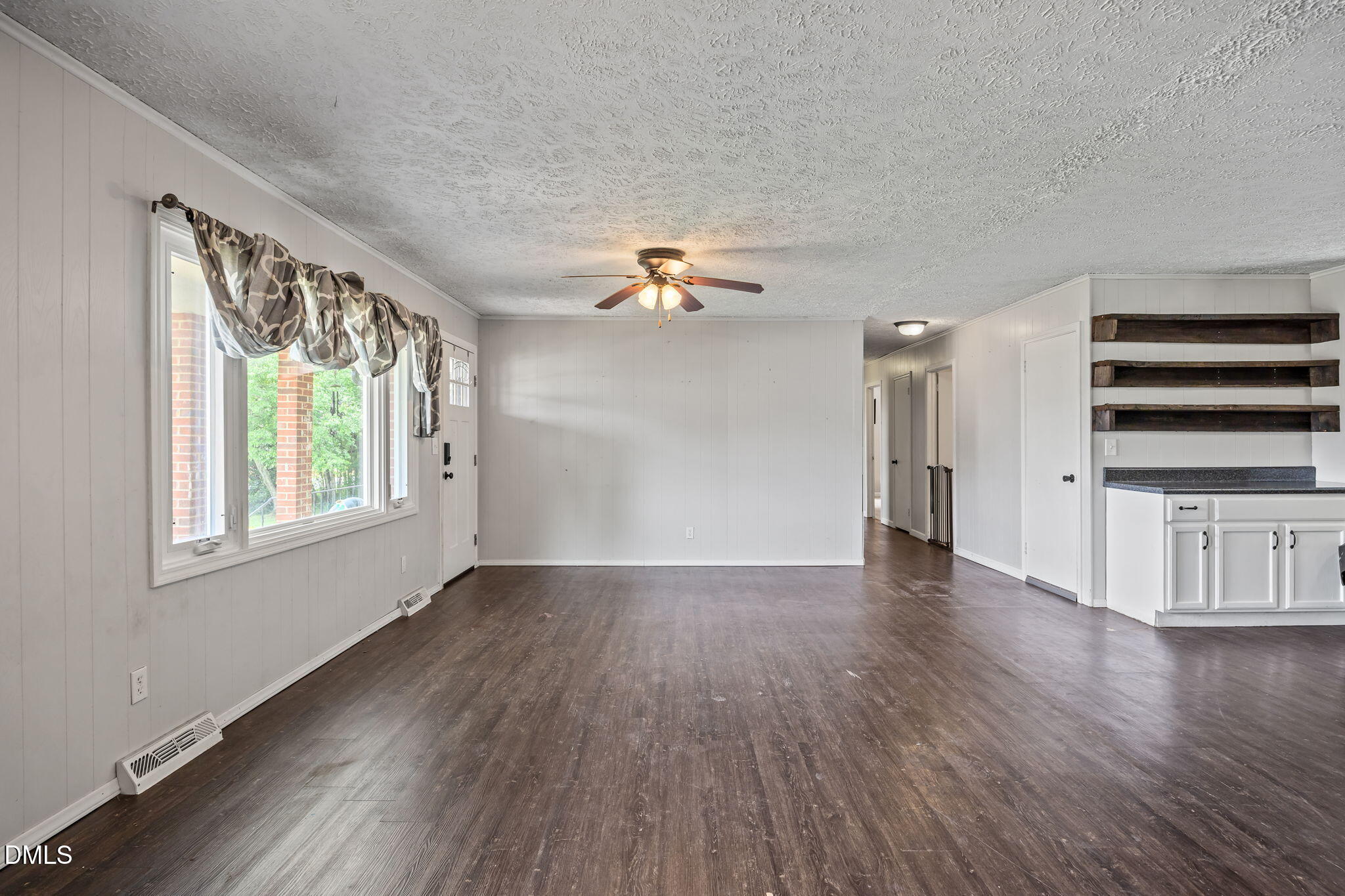 786 Dick Holeman Road Timberlake, NC 27583 - Photo 17 of 44 wooden floor in an empty room with a window
