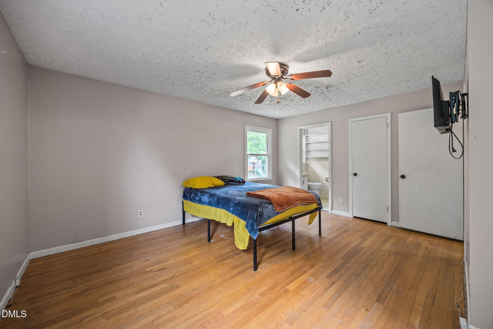 786 Dick Holeman Road Timberlake, NC 27583 - Photo 24 of 44 a room with a bed and a chandelier