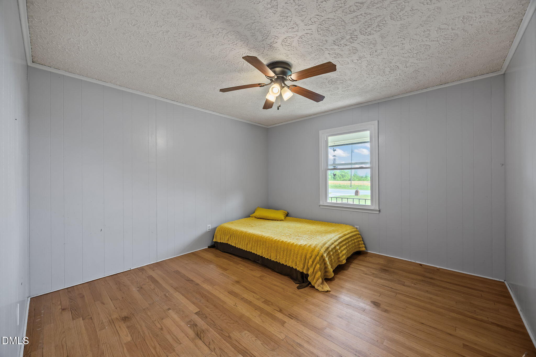 786 Dick Holeman Road Timberlake, NC 27583 - Photo 27 of 44 a bedroom with a bed and a window