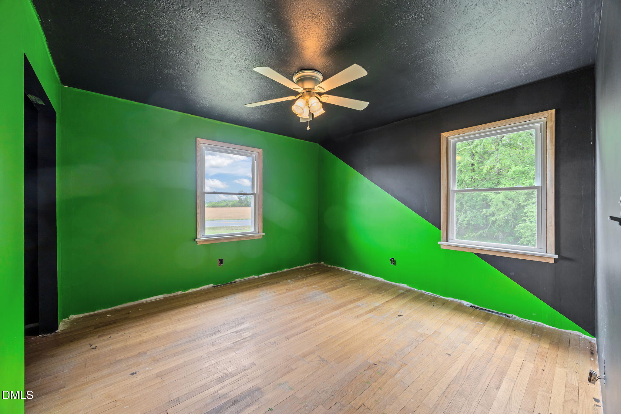 786 Dick Holeman Road Timberlake, NC 27583 - Photo 31 of 44 an empty room with a window and ceiling fan