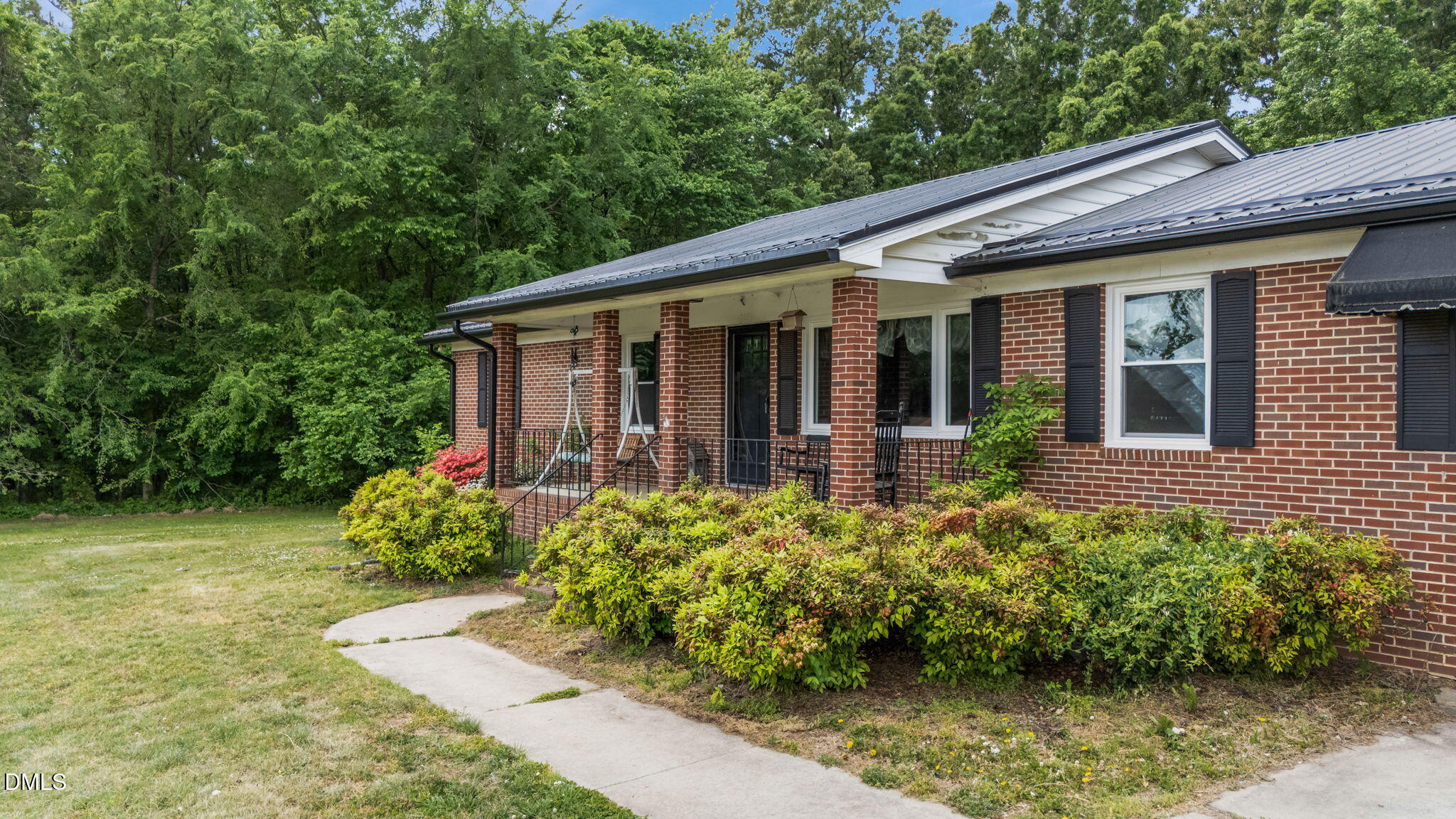 786 Dick Holeman Road Timberlake, NC 27583 - Photo 42 of 44 a view of a house with garden and lawn chairs