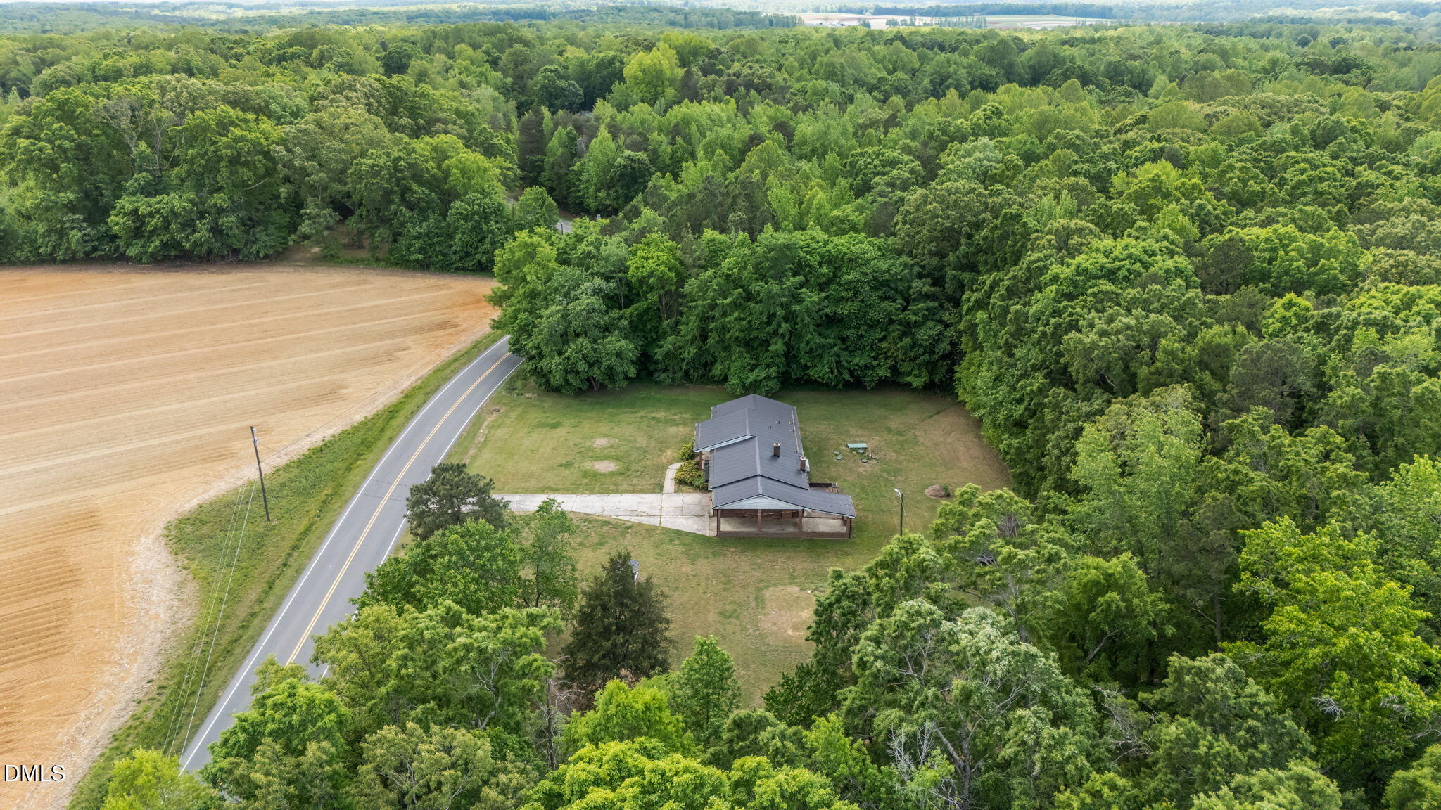 786 Dick Holeman Road Timberlake, NC 27583 - Photo 7 of 44 a view of a lake with a yard