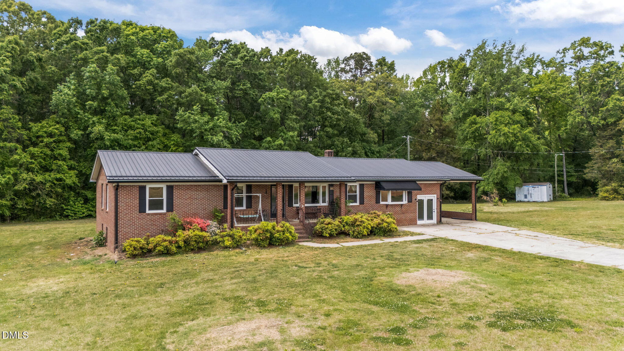 786 Dick Holeman Road Timberlake, NC 27583 - Photo 9 of 44 a front view of a house with garden