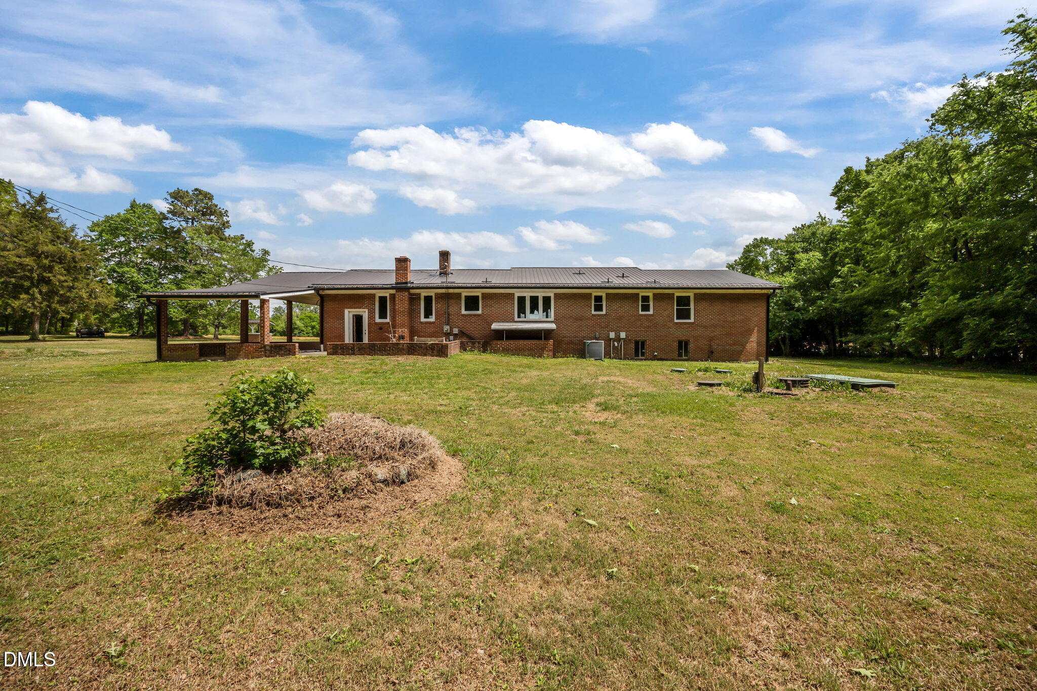 786 Dick Holeman Road Timberlake, NC 27583 - Photo 10 of 44 a view of a house with yard and sitting area