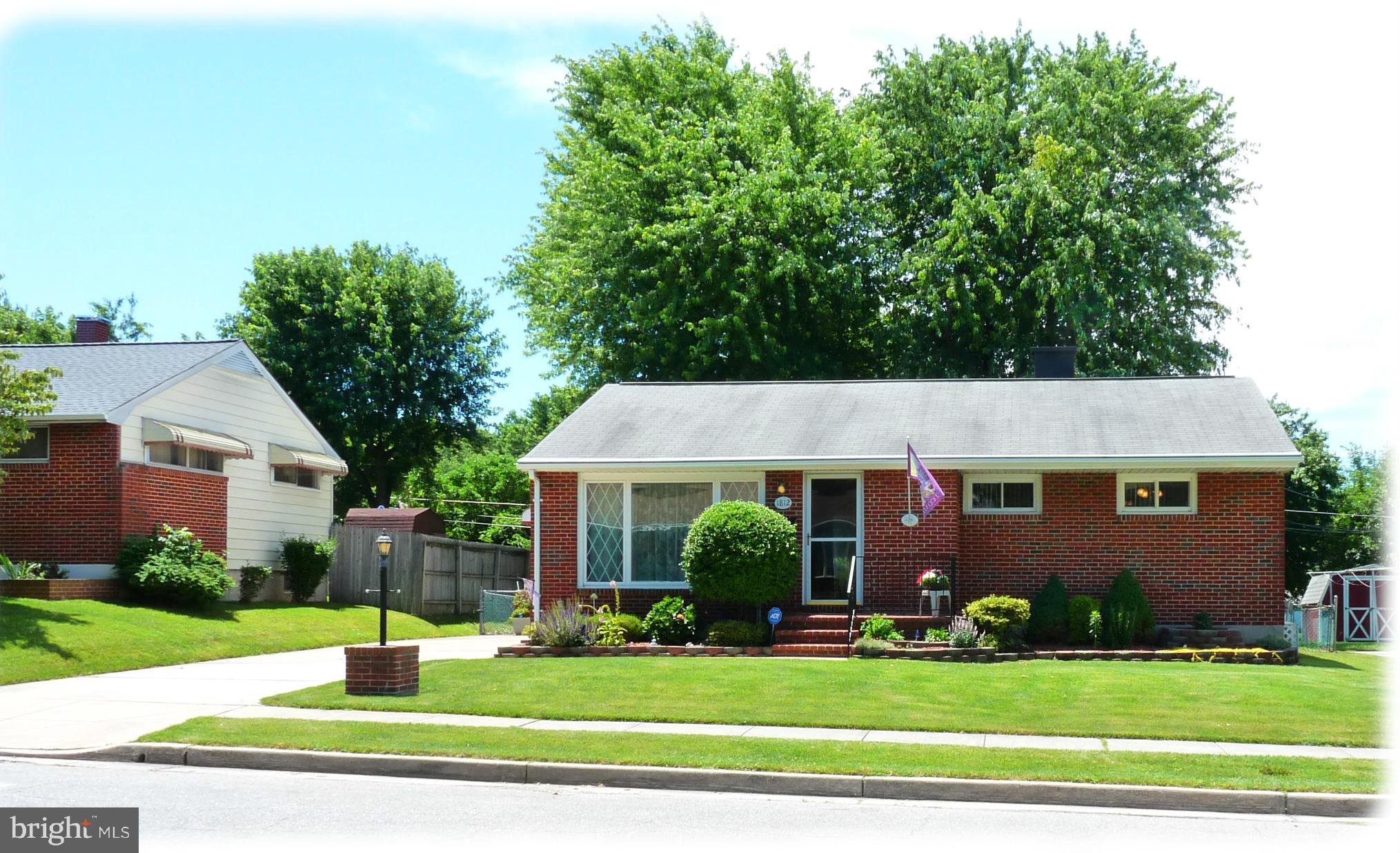 1812 Willann Road Baltimore, MD 21237 - Photo 1 of 26 a front view of a house with a yard