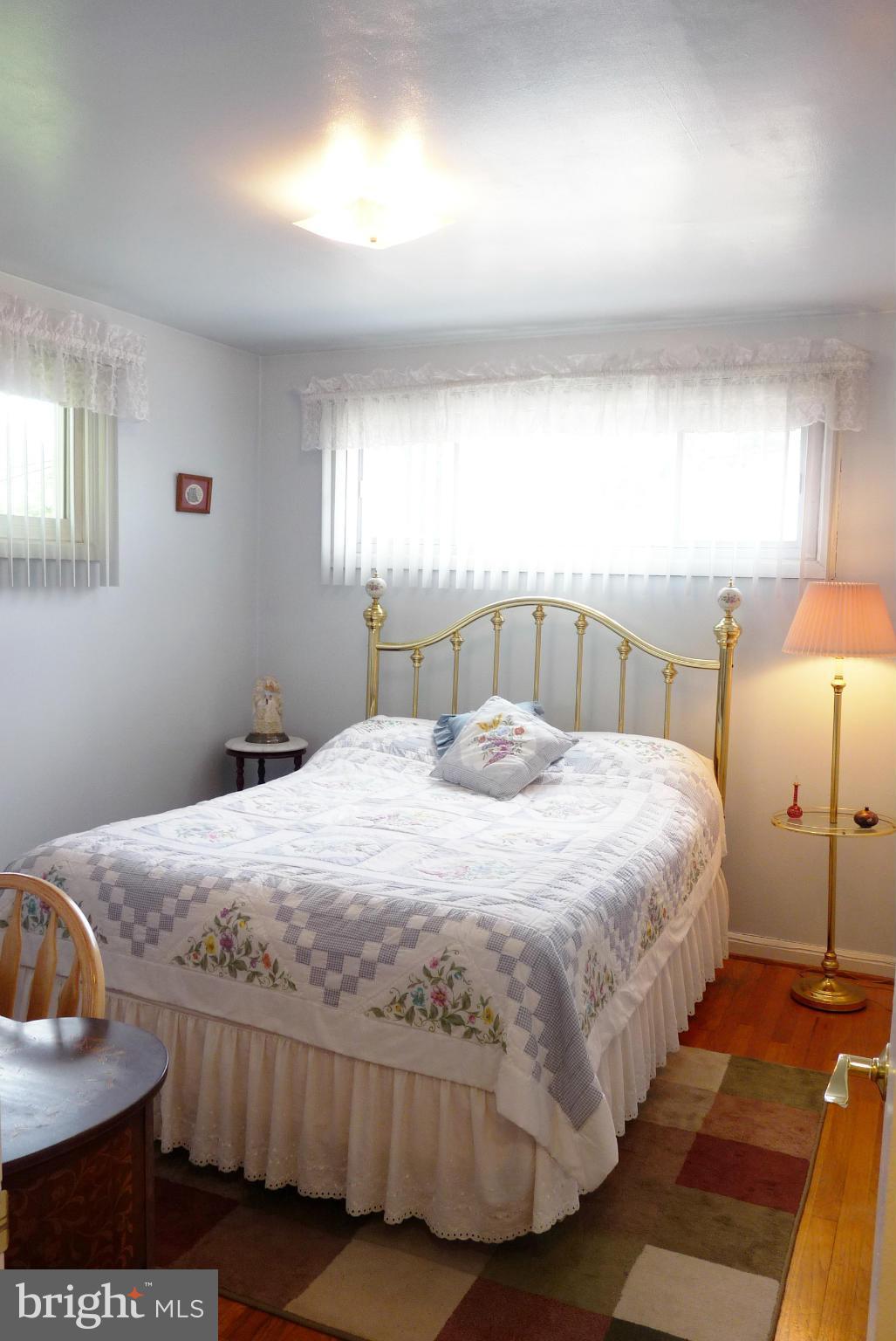 1812 Willann Road Baltimore, MD 21237 - Photo 11 of 26 a bedroom with a bed and window