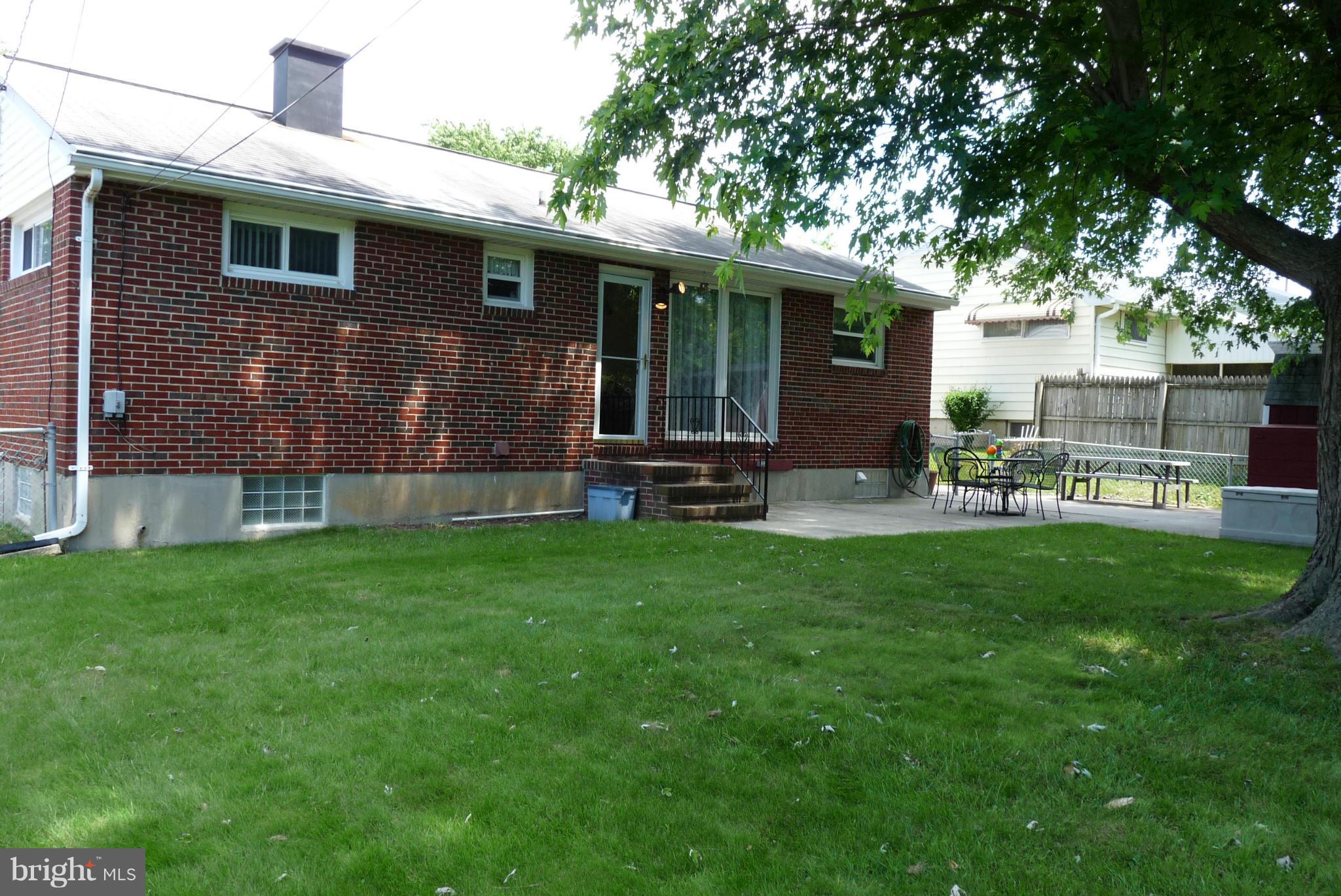 1812 Willann Road Baltimore, MD 21237 - Photo 24 of 26 a view of a house with a yard and sitting area