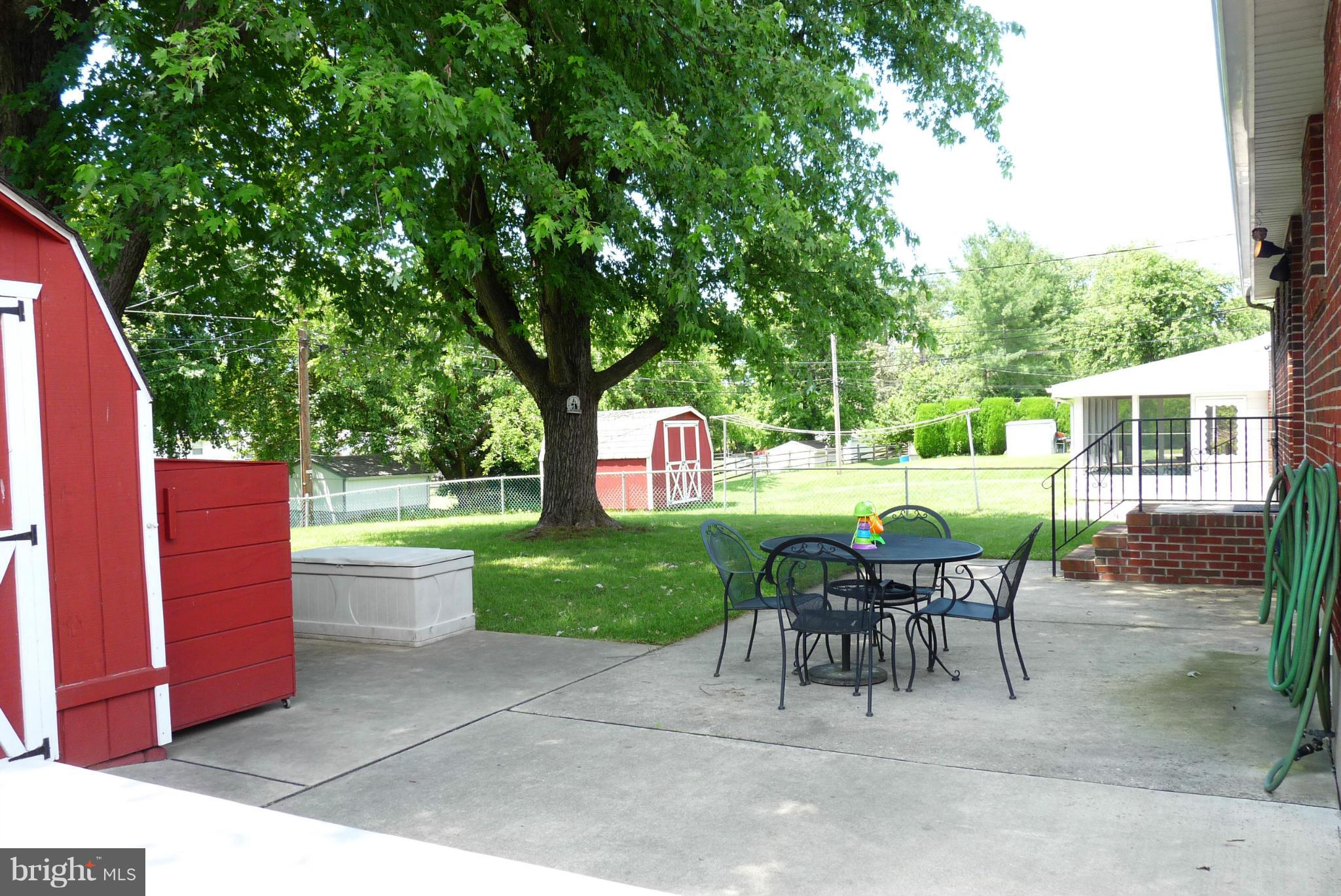 1812 Willann Road Baltimore, MD 21237 - Photo 25 of 26 a view of a chairs and table in the back yard of the house