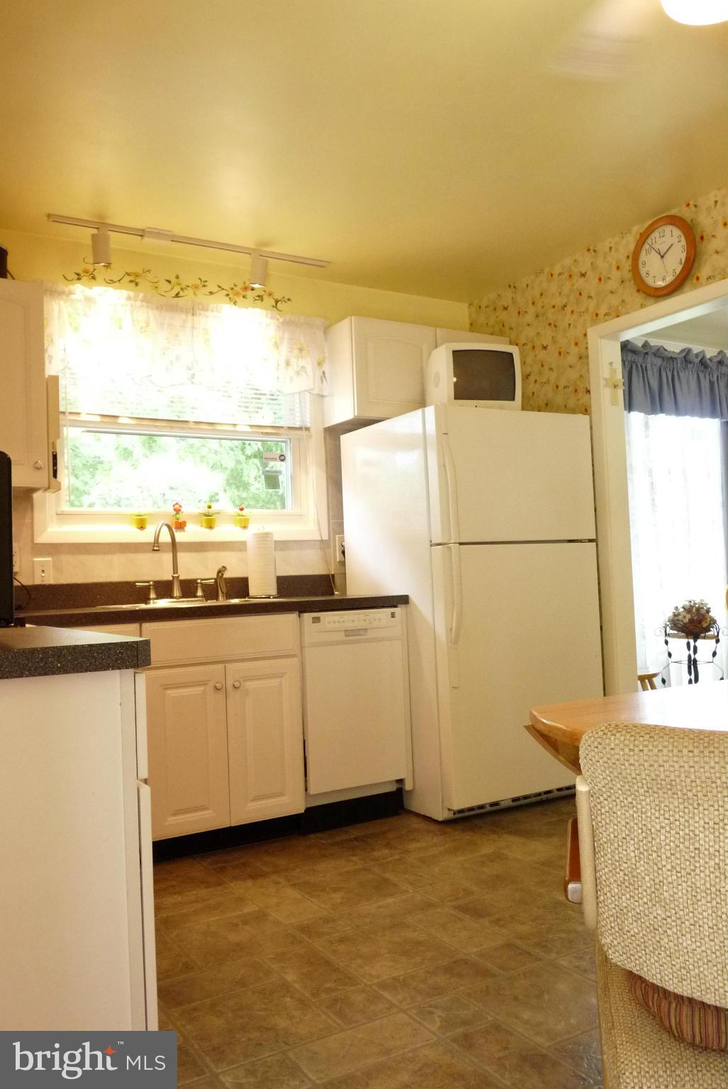 1812 Willann Road Baltimore, MD 21237 - Photo 6 of 26 a kitchen with stainless steel appliances granite countertop a sink and a stove