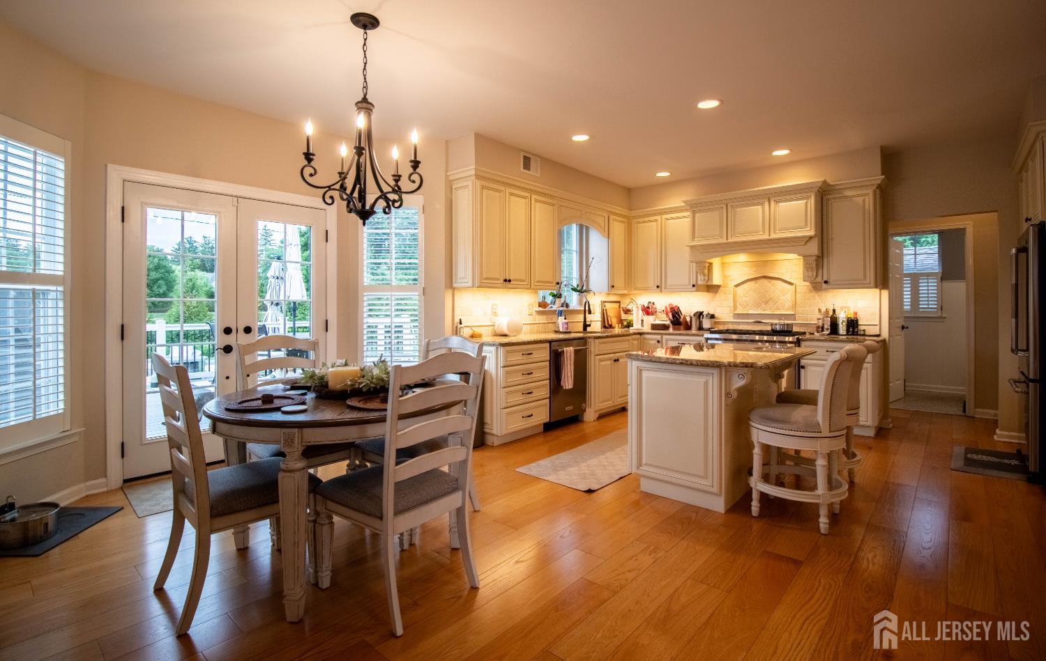 9 Pondview Drive Tinton Falls, NJ 07724 - Photo 14 of 41 a view of a dining room with furniture window and wooden floor